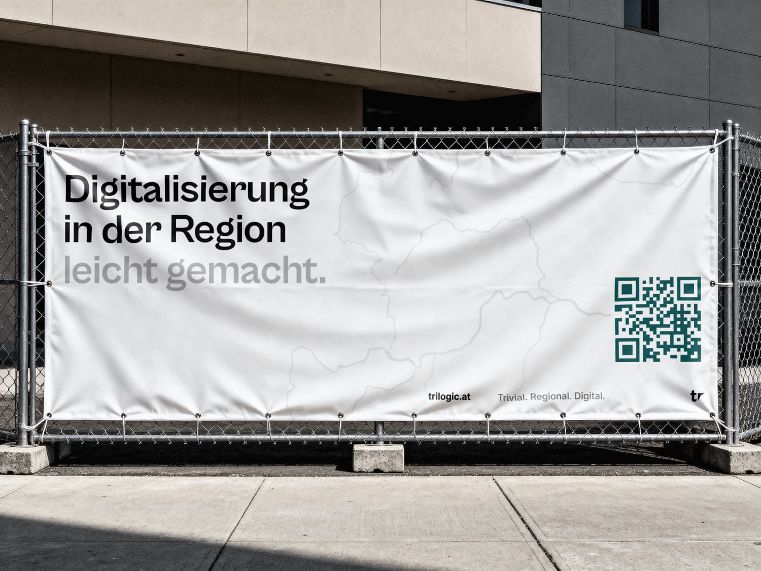 Trilogic Banner an Bauzaun